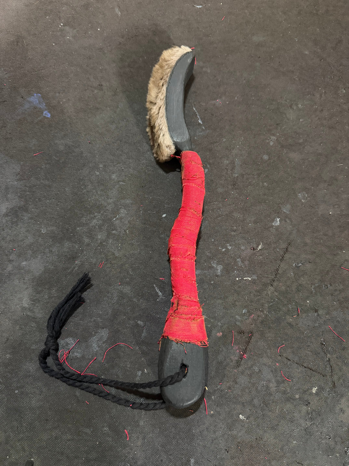 Full length view of the curved shaman drum beater
