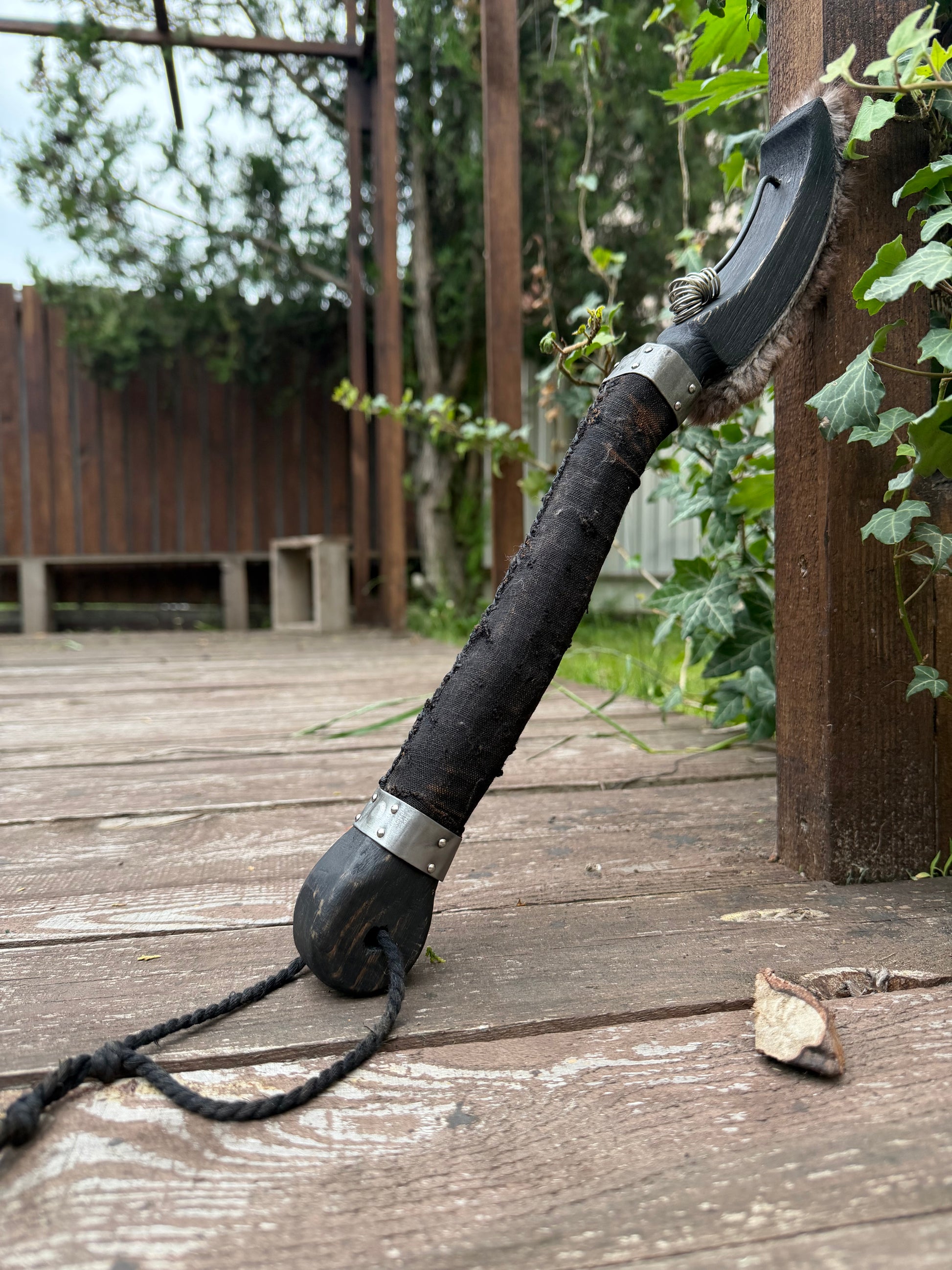 Ritual ring beater standing — full view