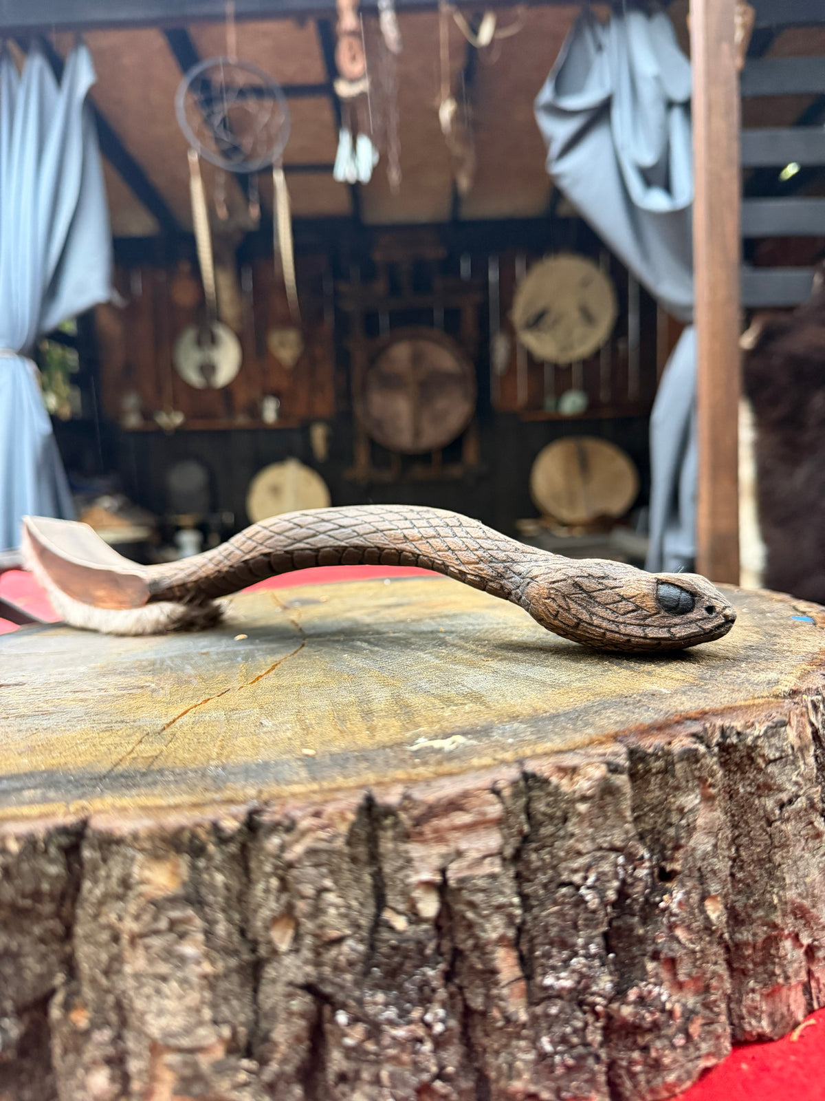 Snake drum beater, carved scales along the handle